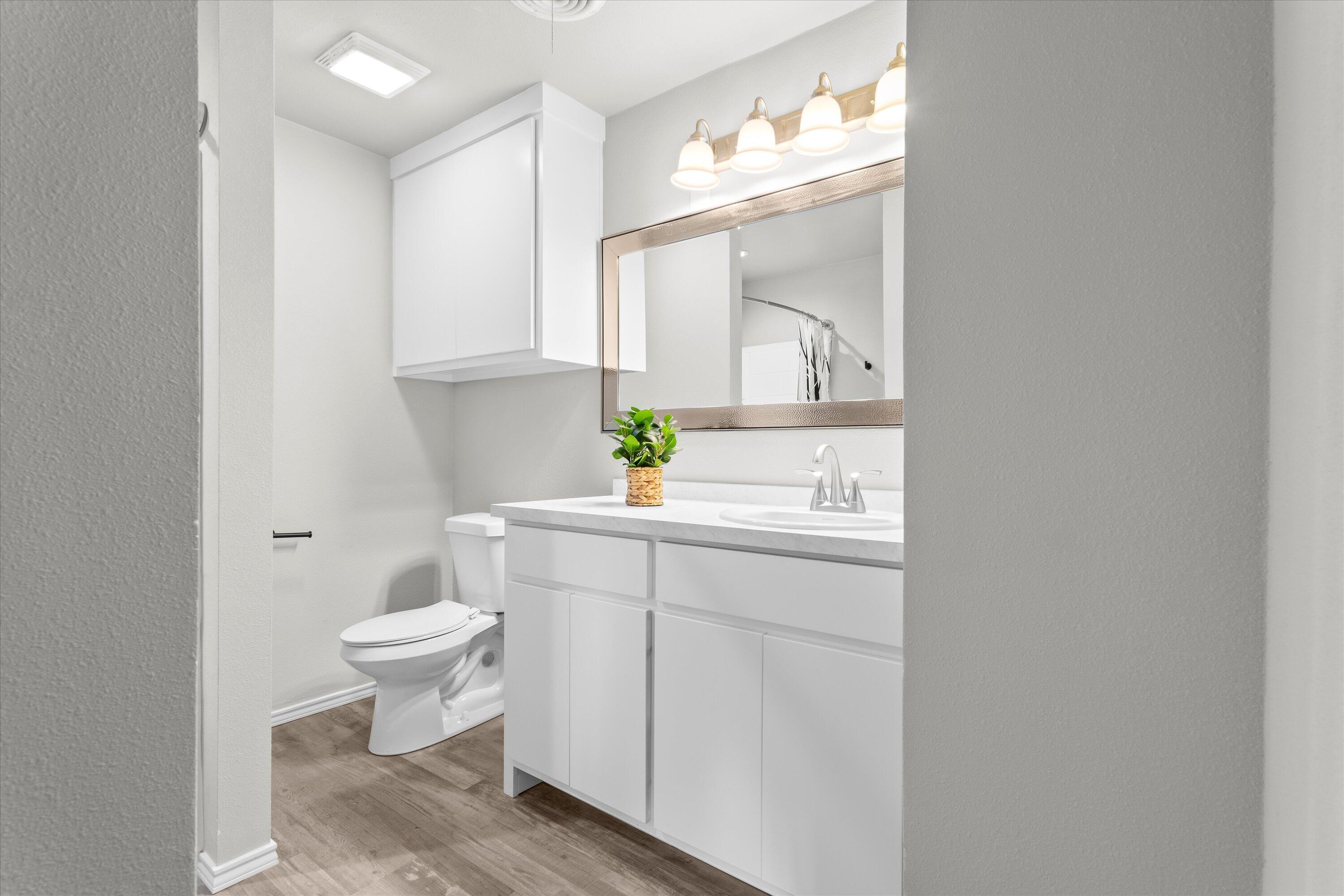 327 Hiracheta Drive New Home, TX 79381 - Photo 21 of 26 a bathroom with a sink toilet and mirror