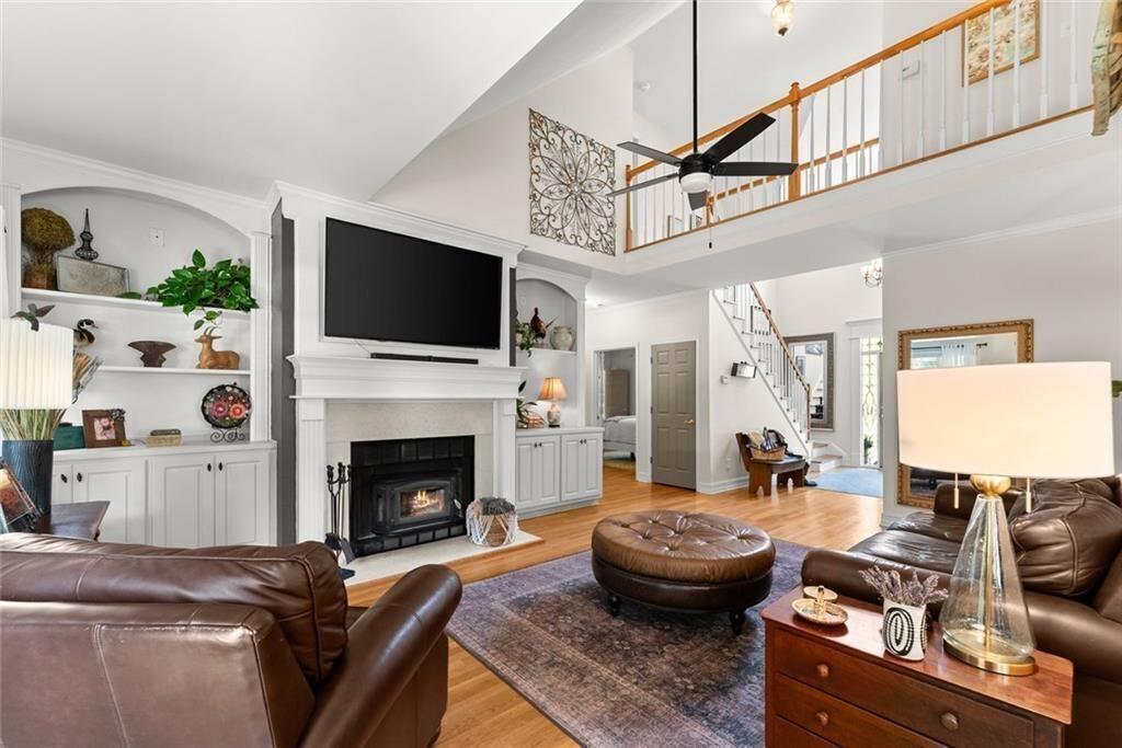 195 Sims Farm Way Maysville, GA 30558 - Photo 15 of 58 a living room with furniture a flat screen tv and a fireplace