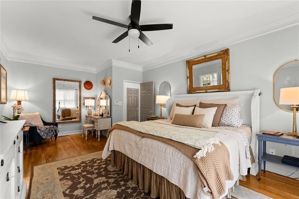 195 Sims Farm Way Maysville, GA 30558 - Photo 19 of 58 a bedroom with a bed a couch and dresser