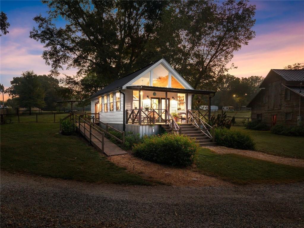 195 Sims Farm Way Maysville, GA 30558 - Photo 39 of 58 a front view of a house with garden