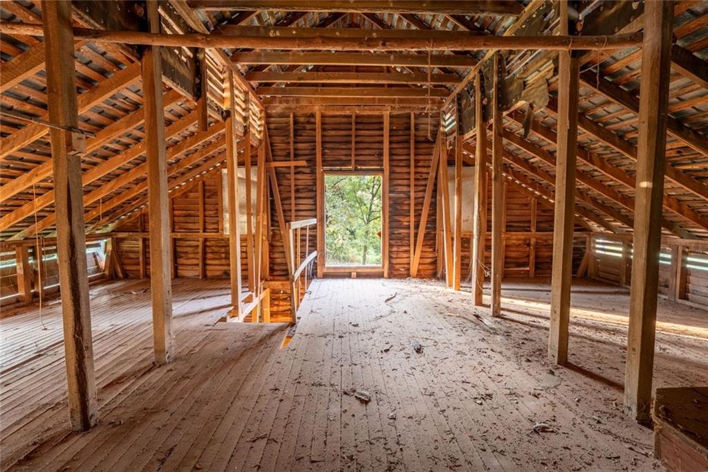 195 Sims Farm Way Maysville, GA 30558 - Photo 58 of 58 a view of an empty room with wooden floor and a window