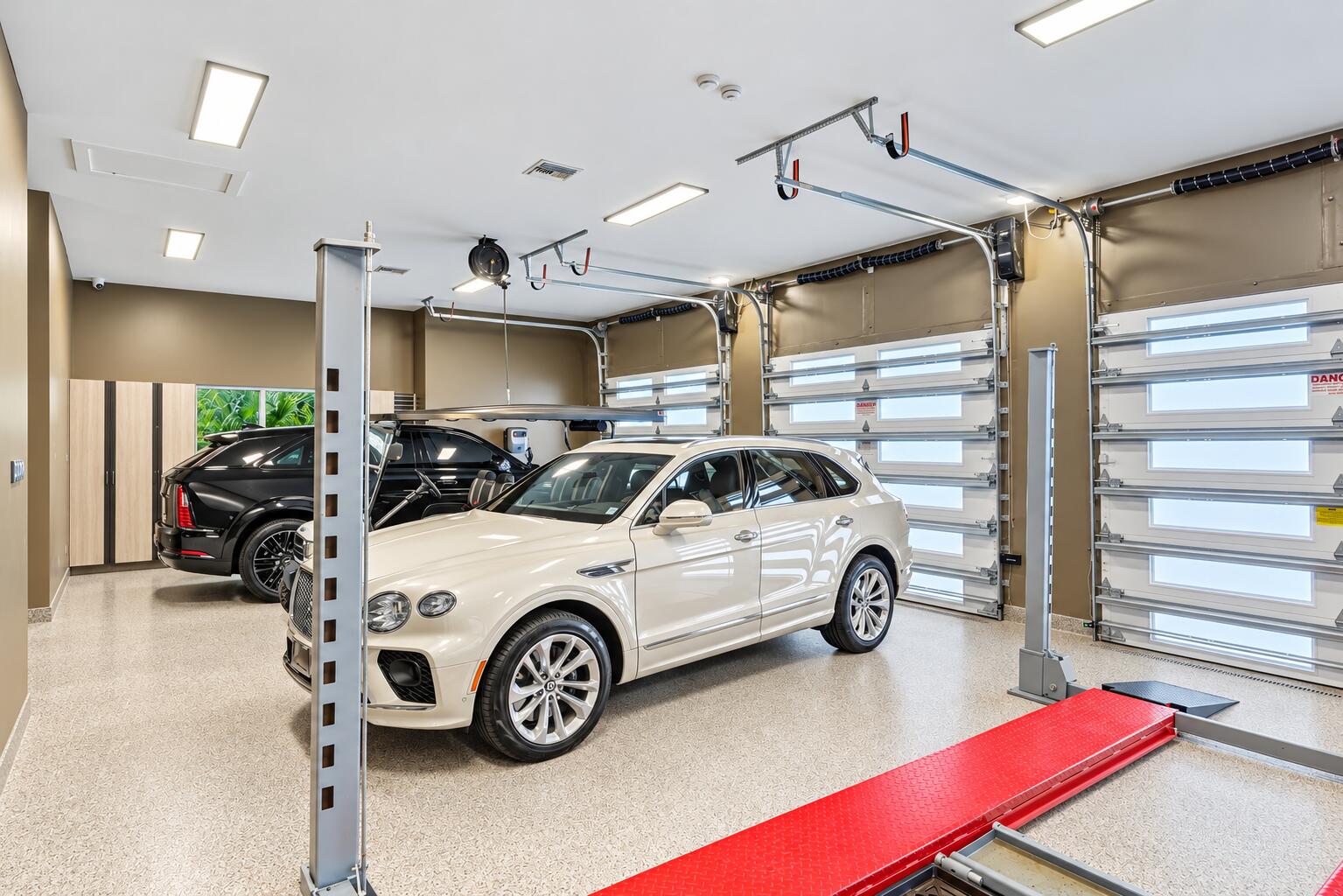 13920 Stirling Road Southwest Ranches, FL 33330 - Photo 81 of 81 Brightened luxury garage with two SUVs