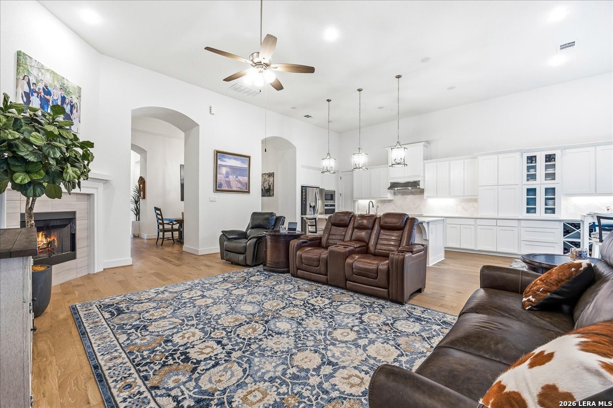 421 Corwin Springs Cibolo, TX 78108 - Photo 11 of 42 a living room with furniture kitchen view and a chandelier