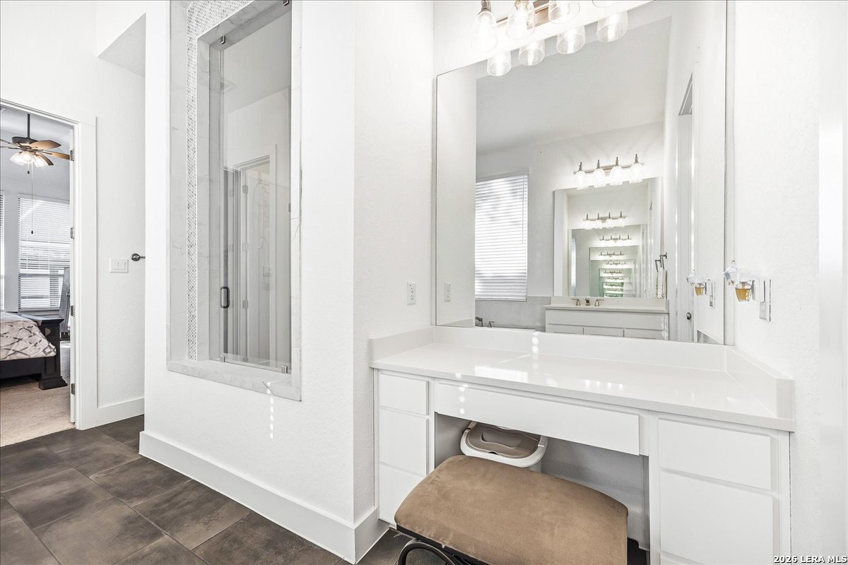 421 Corwin Springs Cibolo, TX 78108 - Photo 22 of 42 a bathroom with a sink and a mirror