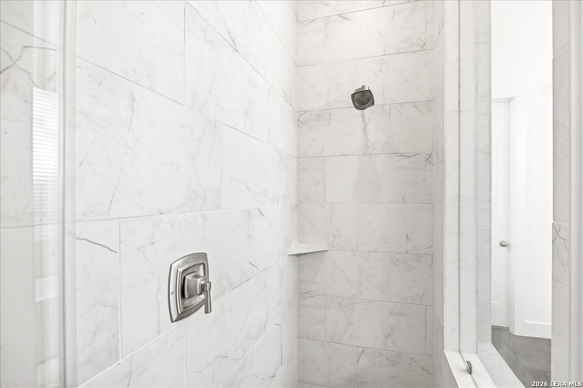 421 Corwin Springs Cibolo, TX 78108 - Photo 23 of 42 a bathroom with a shower
