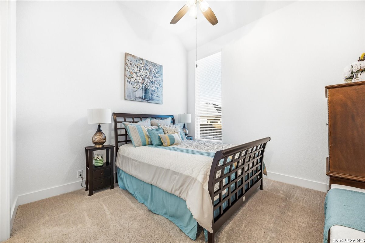 421 Corwin Springs Cibolo, TX 78108 - Photo 26 of 42 a bedroom with a bed and a cabinets