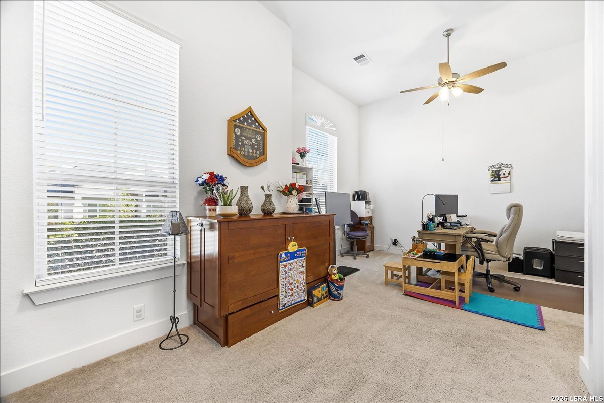 421 Corwin Springs Cibolo, TX 78108 - Photo 29 of 42 a room with furniture and a window