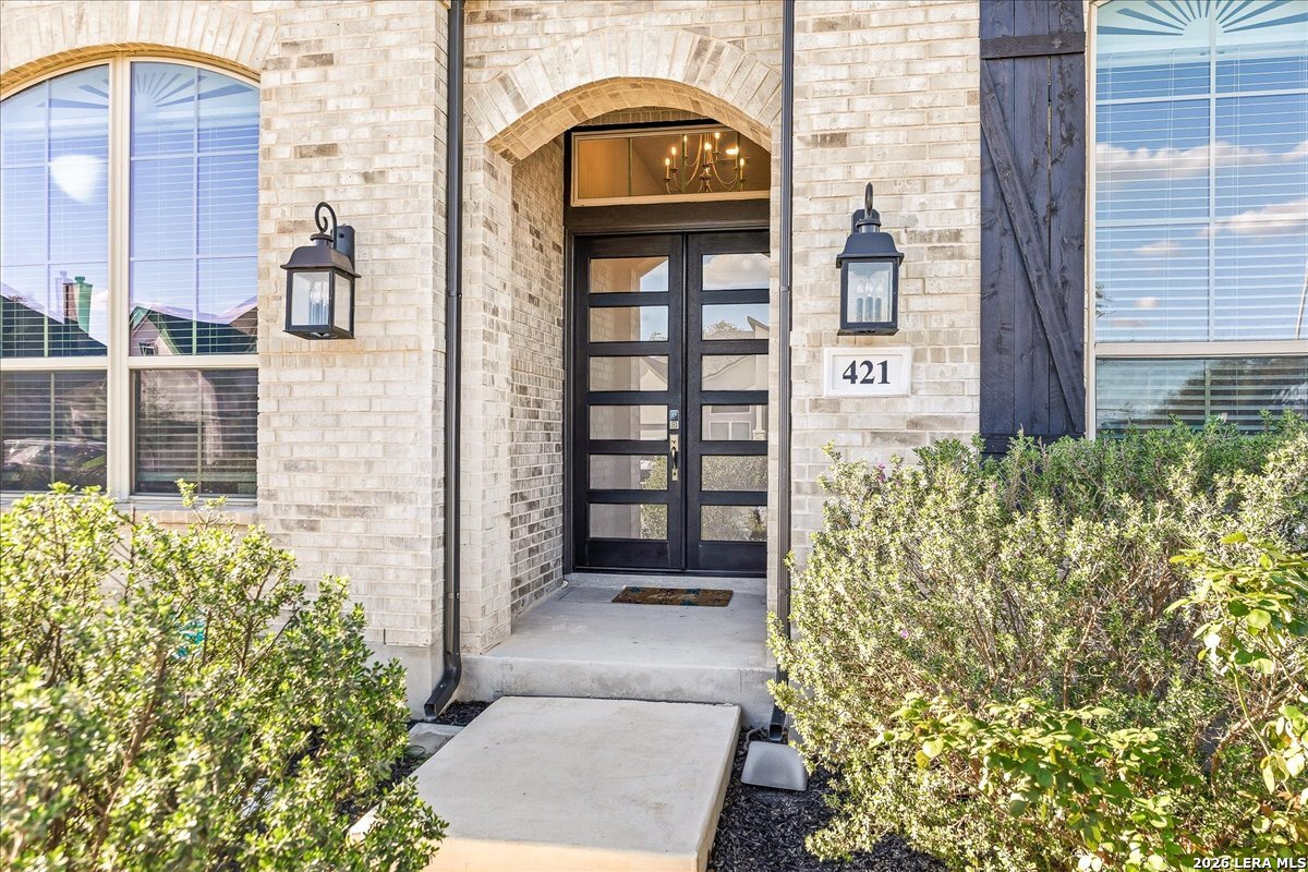 421 Corwin Springs Cibolo, TX 78108 - Photo 3 of 42 a view of front door of house and wooden door