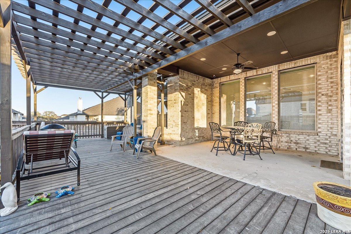 421 Corwin Springs Cibolo, TX 78108 - Photo 37 of 42 a view of a patio with table and chairs with wooden floor