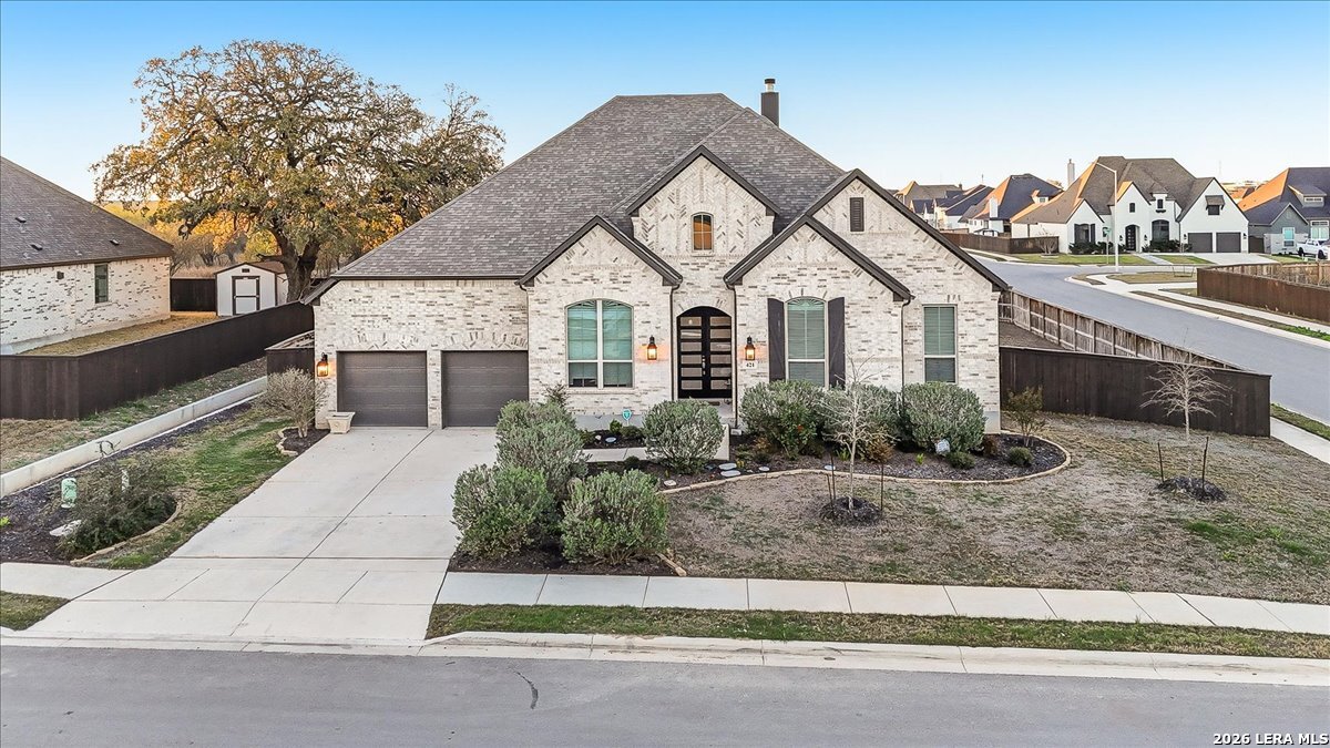 421 Corwin Springs Cibolo, TX 78108 - Photo 41 of 42 a front view of a house with a yard and garage