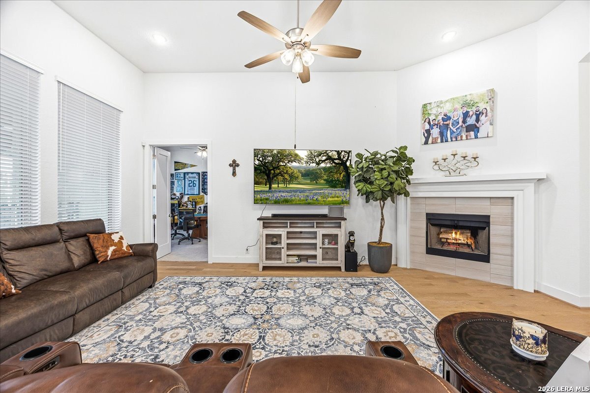 421 Corwin Springs Cibolo, TX 78108 - Photo 10 of 42 a living room with furniture and a fireplace