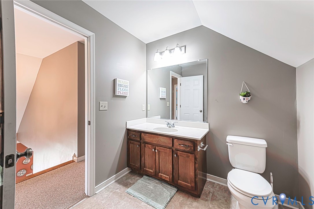 827 Sutherland Road Church Road, VA 23833 - Photo 24 of 51 Bathroom with a single vanity featuring wood cabin