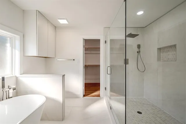 a bathroom with a shower and a tub