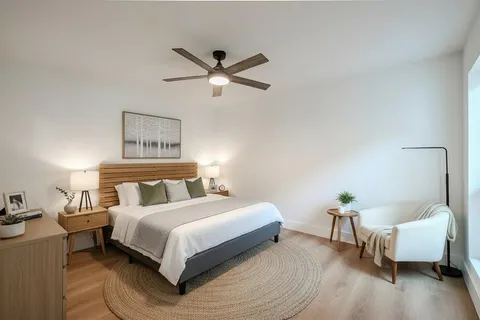 a bedroom with a bed and a couch