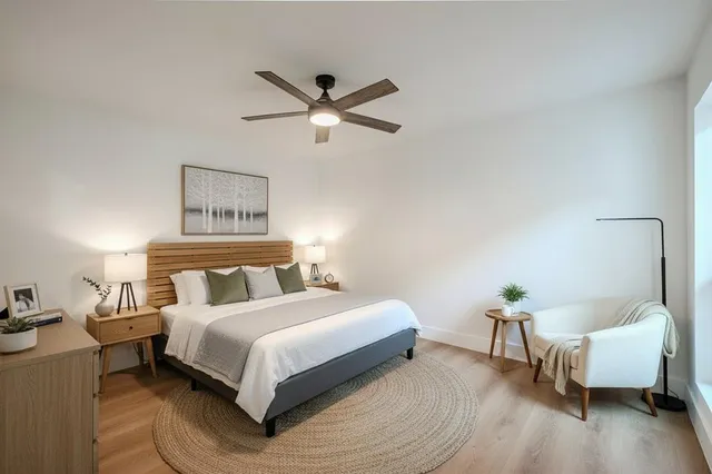 a bedroom with a bed and a couch