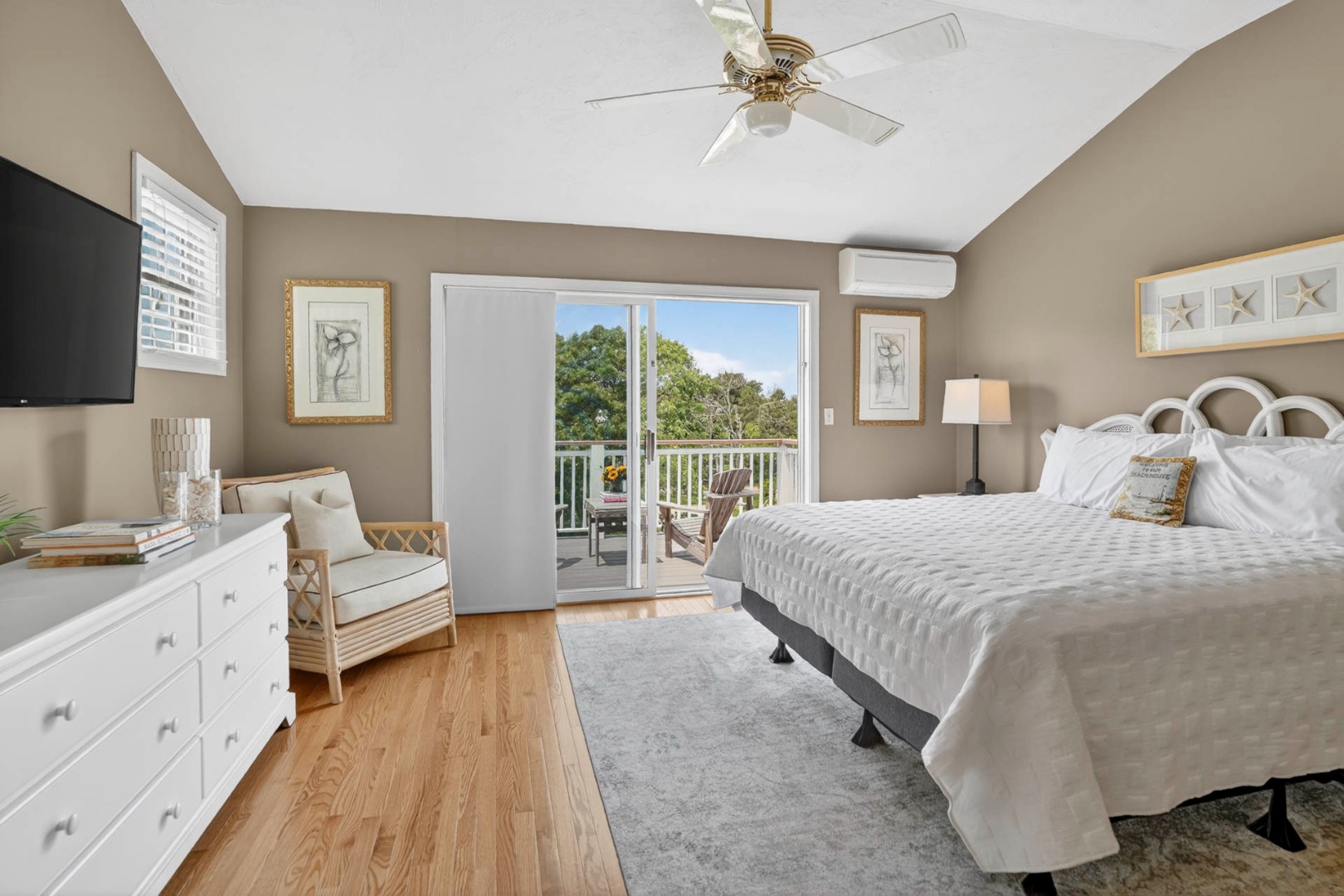 9 Thaxter Lane Edgartown, MA 02539 - Photo 27 of 53 a bedroom with a large bed and a flat tv screen on dresser