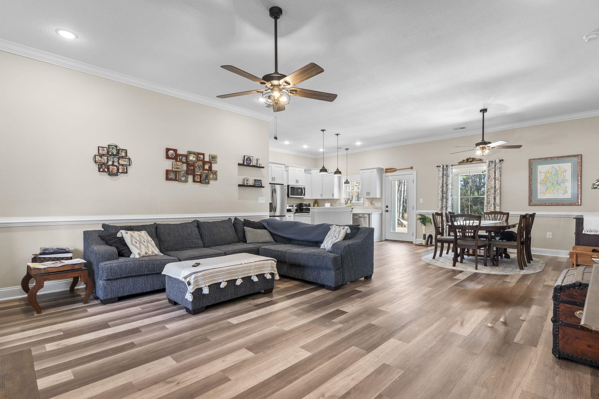 3394 Dusty Road Loris, SC 29569 - Photo 13 of 37 Living area with a ceiling fan, ornamental molding, wood finished floors, and recessed lighting