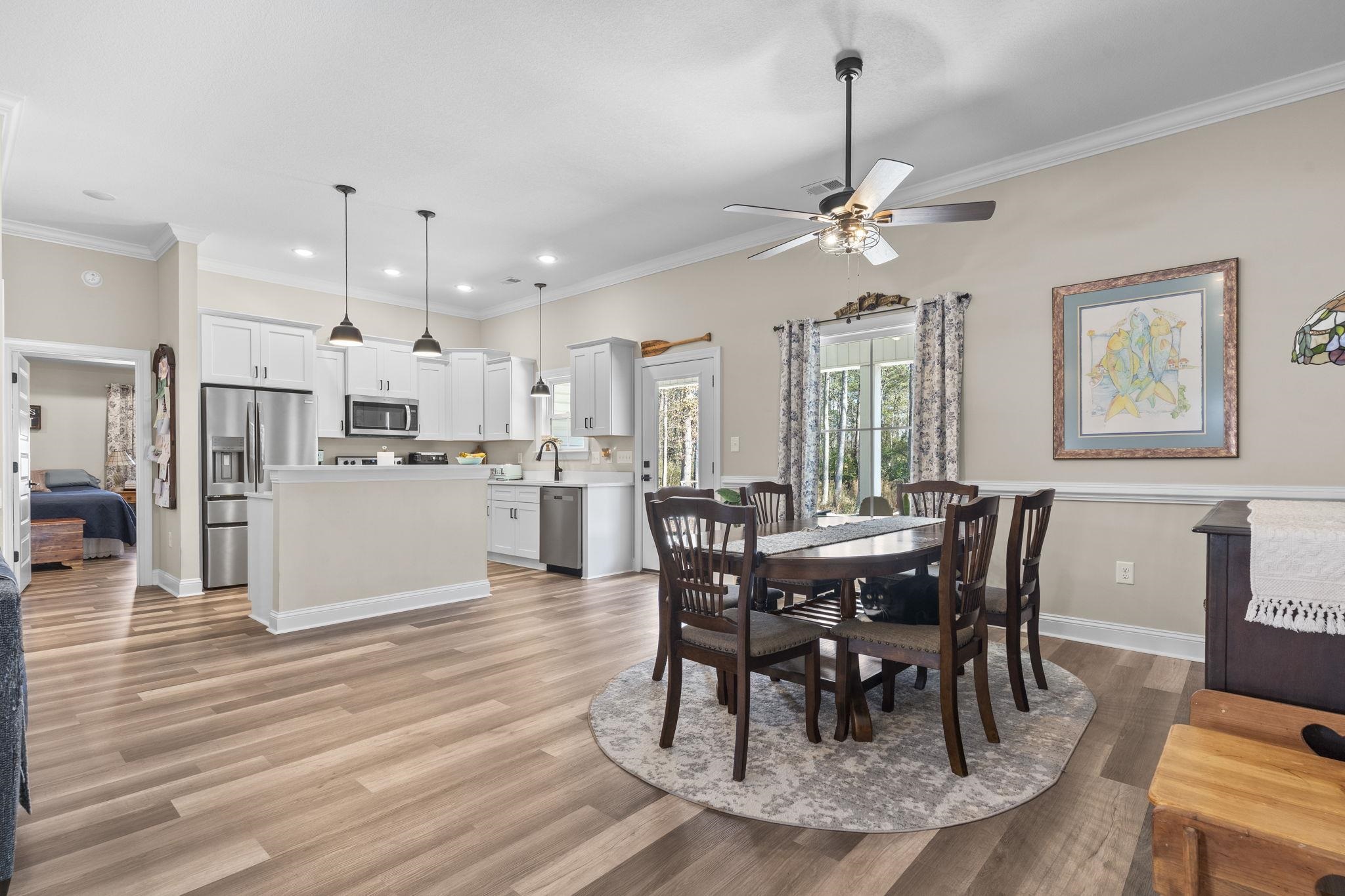 3394 Dusty Road Loris, SC 29569 - Photo 15 of 37 Dining area featuring light wood-style floors, ornamental molding, ceiling fan, and recessed lighting