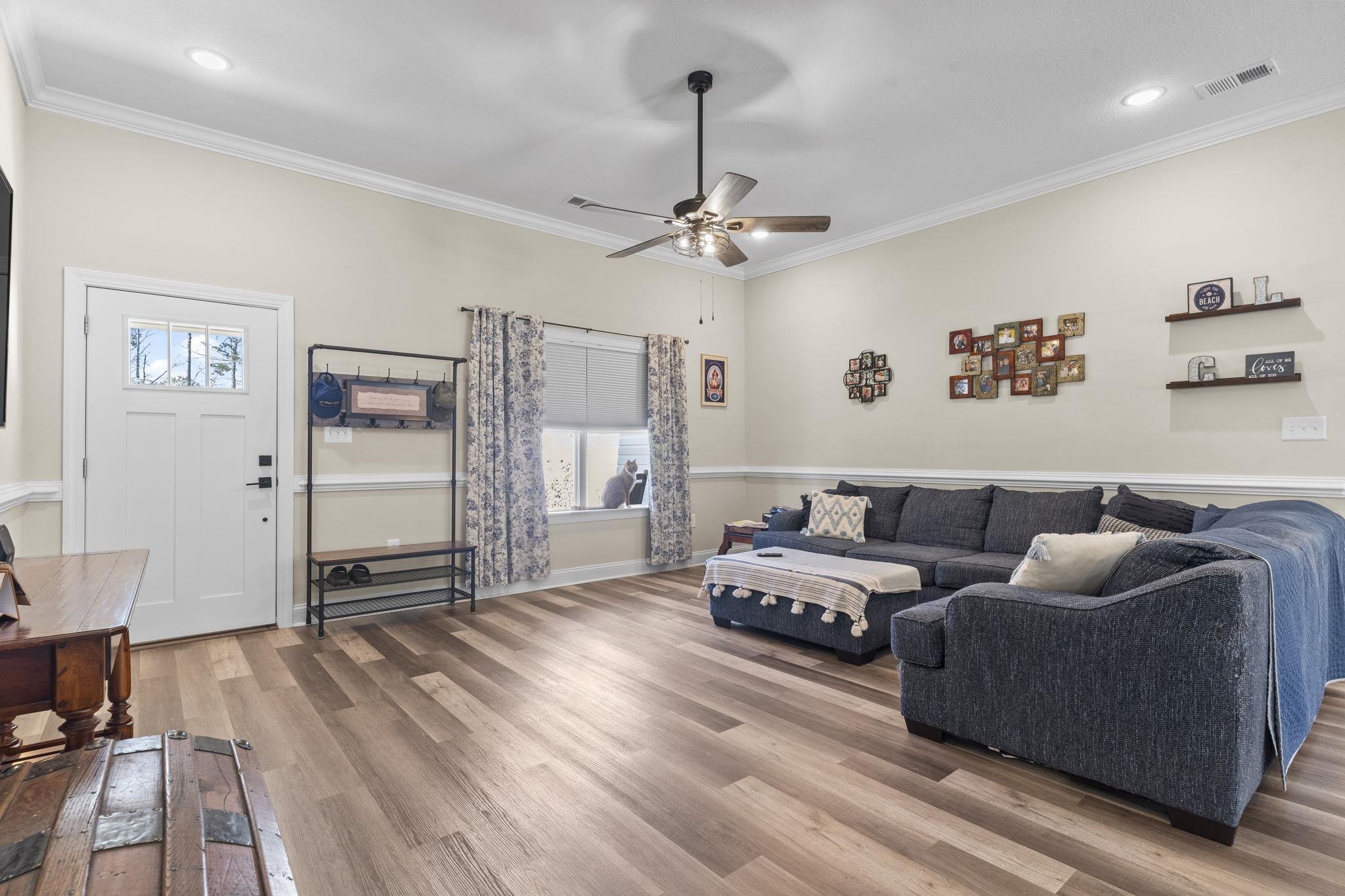 3394 Dusty Road Loris, SC 29569 - Photo 16 of 37 Living room with crown molding, light wood-type flooring, ceiling fan, and recessed lighting
