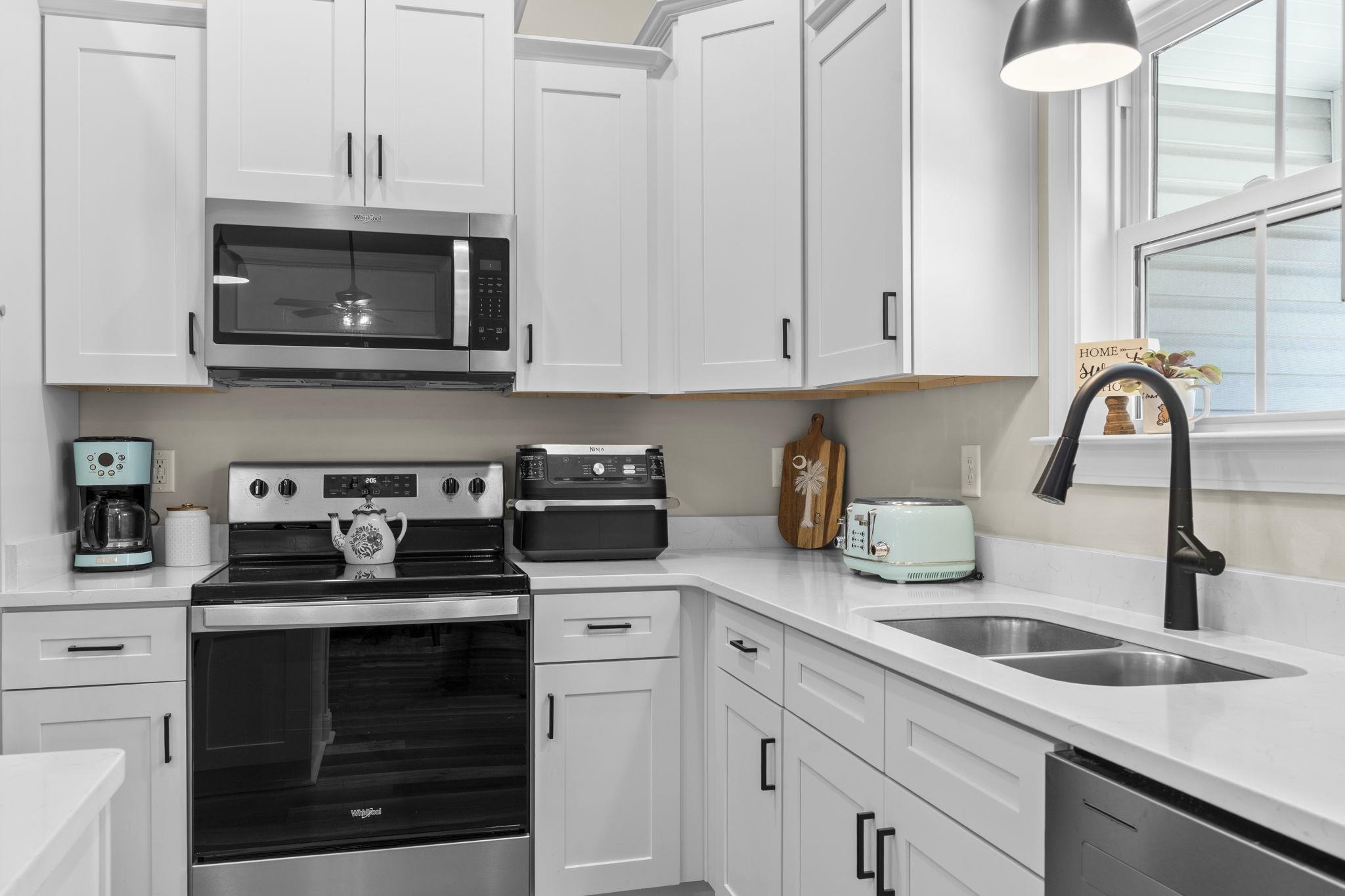 3394 Dusty Road Loris, SC 29569 - Photo 23 of 37 Kitchen featuring stainless steel appliances, white cabinets, and light stone countertops