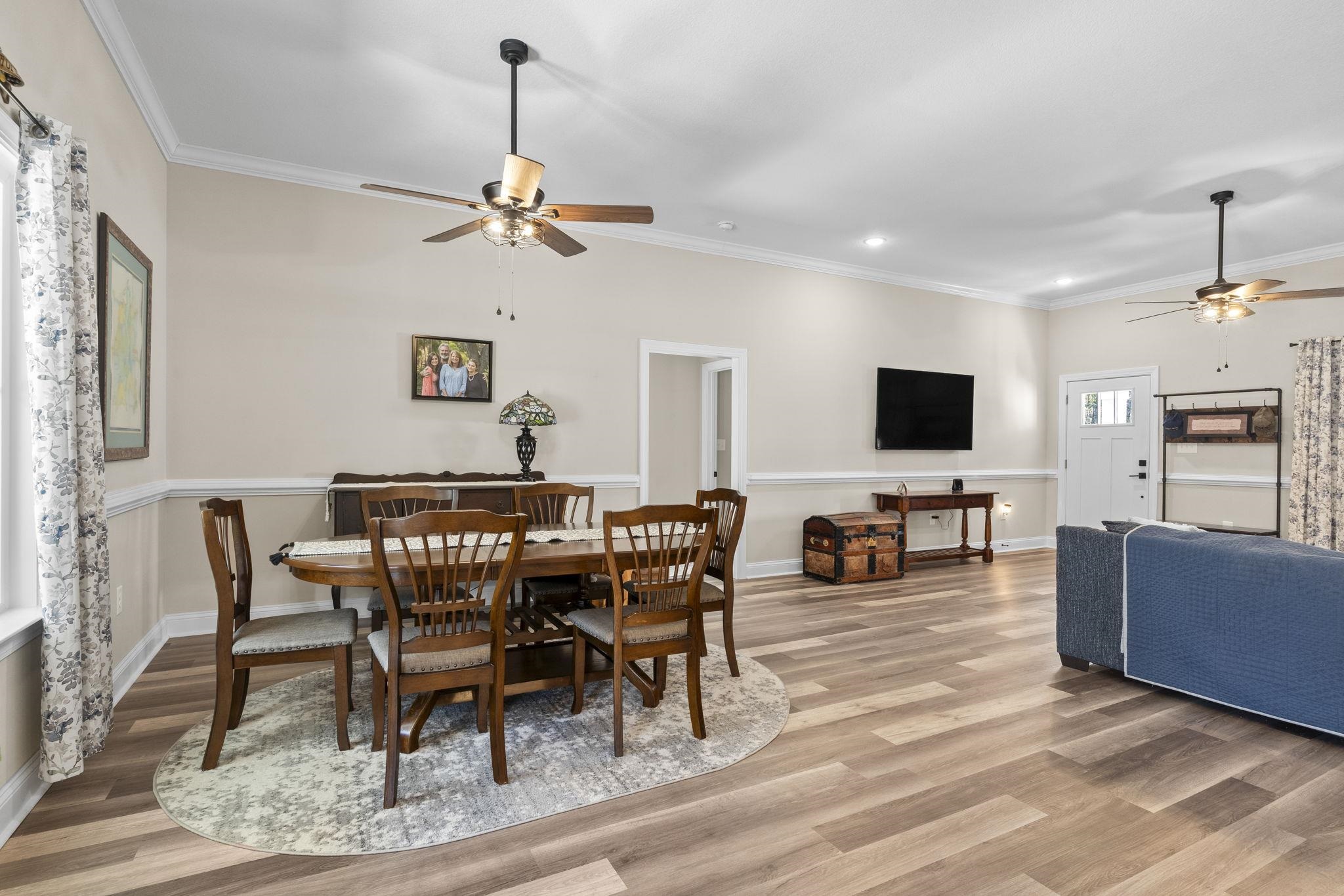 3394 Dusty Road Loris, SC 29569 - Photo 24 of 37 Dining area with ceiling fan, crown molding, wood finished floors, and recessed lighting