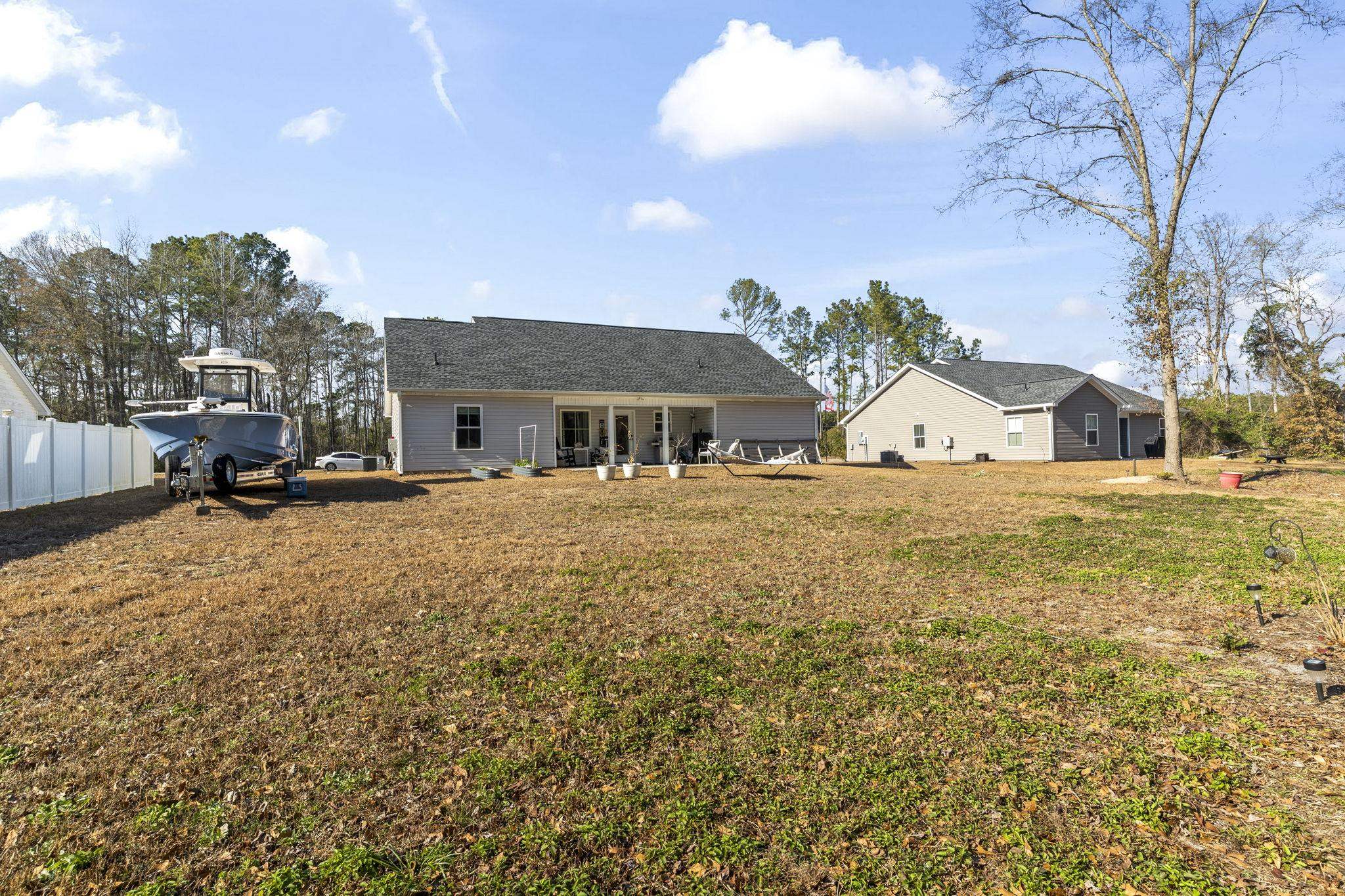 3394 Dusty Road Loris, SC 29569 - Photo 30 of 37 Back of house featuring a patio and a yard