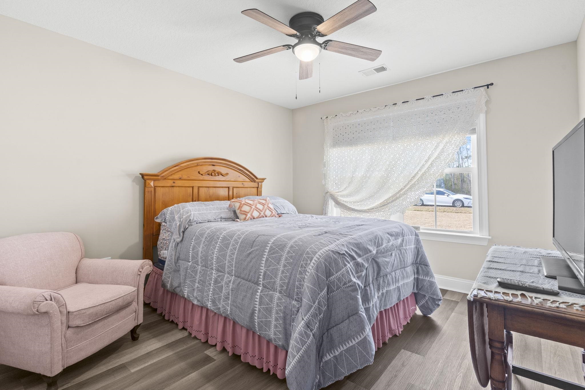 3394 Dusty Road Loris, SC 29569 - Photo 5 of 37 Bedroom featuring wood finished floors and a ceiling fan