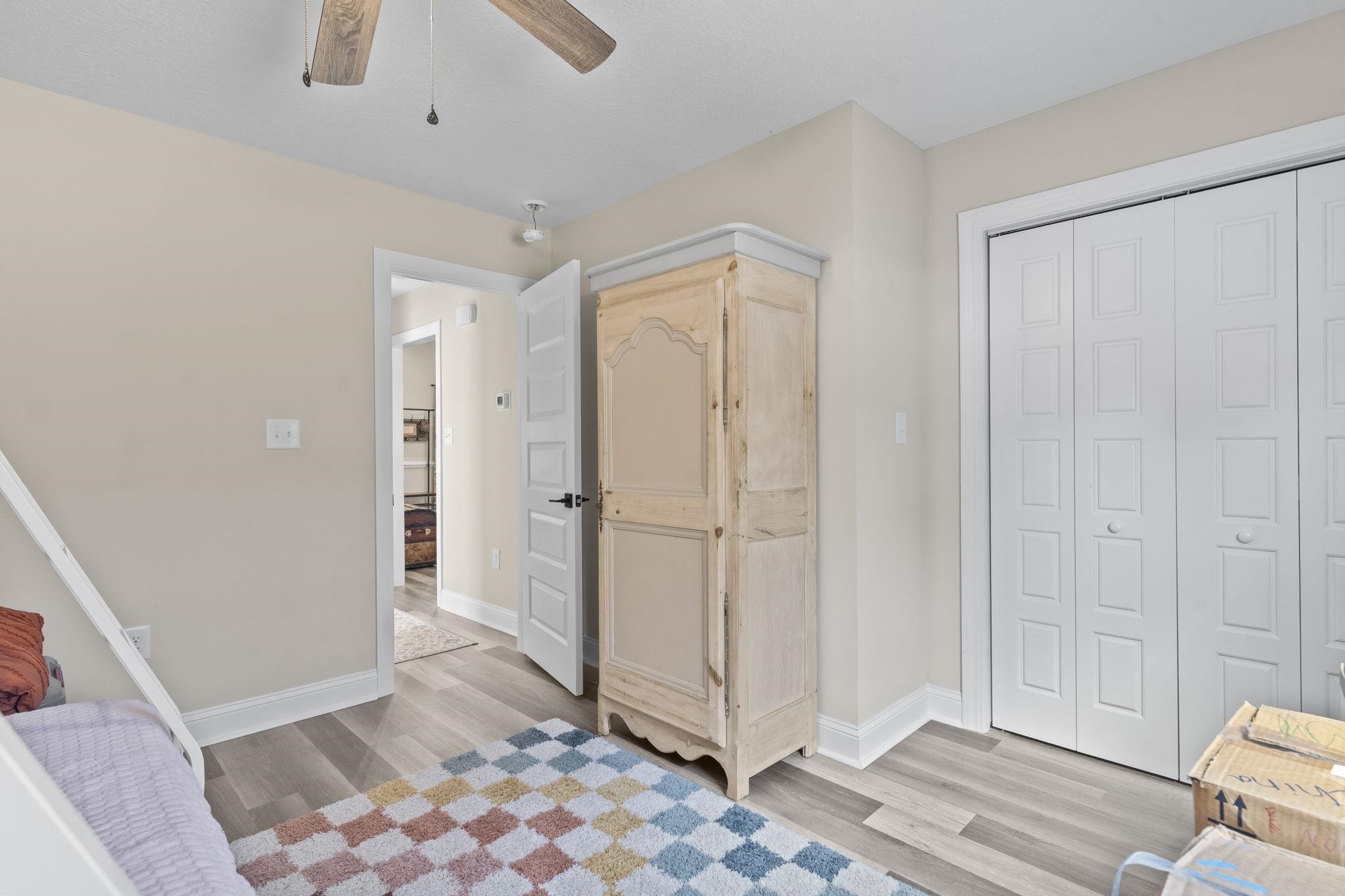 3394 Dusty Road Loris, SC 29569 - Photo 8 of 37 Bedroom with light wood-style flooring, a ceiling fan, and a closet