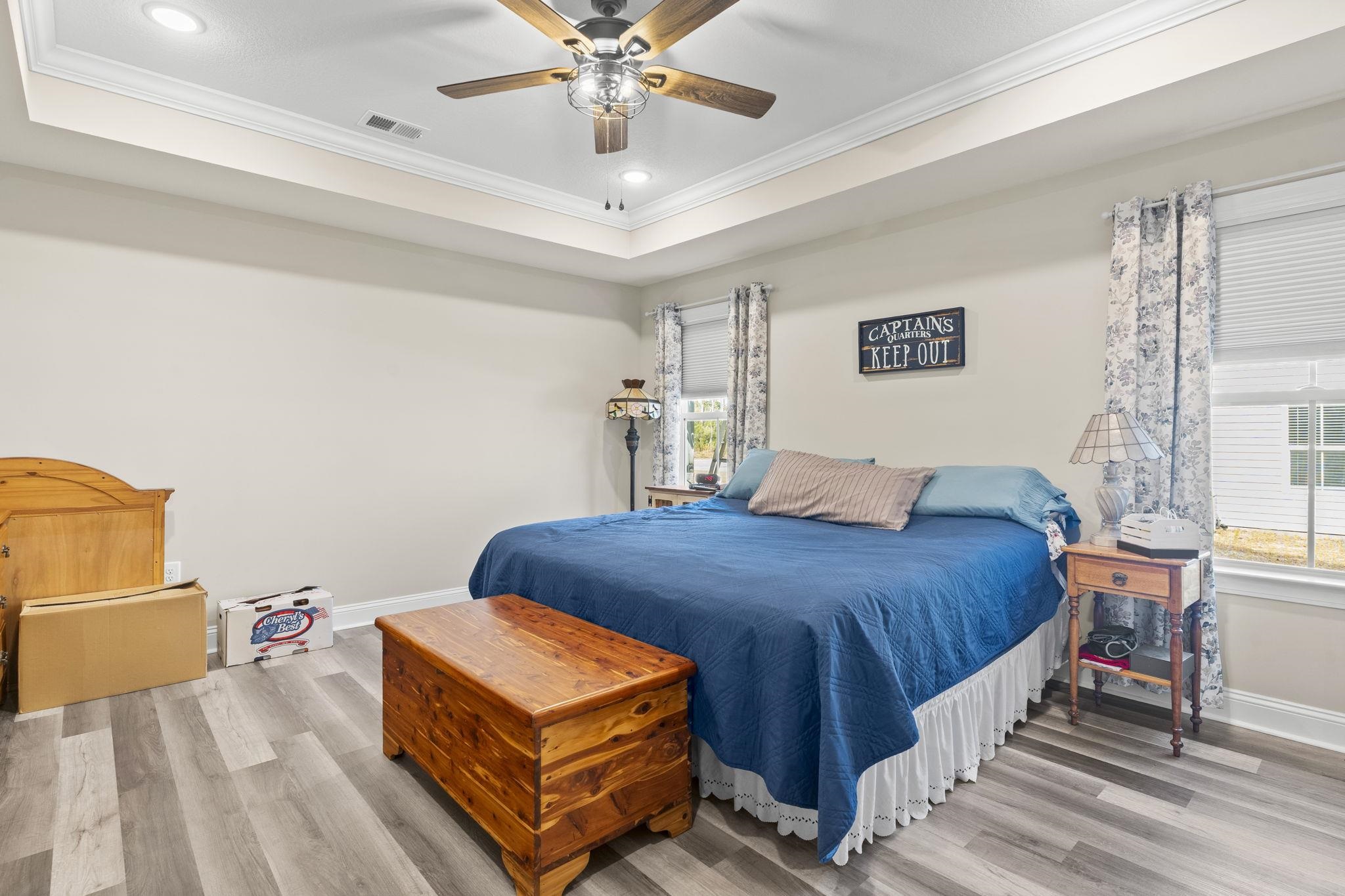 3394 Dusty Road Loris, SC 29569 - Photo 9 of 37 Bedroom featuring ornamental molding, wood finished floors, ceiling fan, a tray ceiling, and recessed lighting