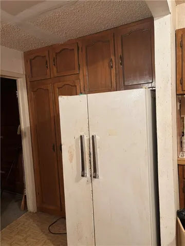 a kitchen with a sink cabinets and a wooden floor