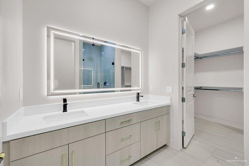 2309 Trinity Avenue McAllen, TX 78504 - Photo 11 of 31 a bathroom with a double vanity sink mirror and