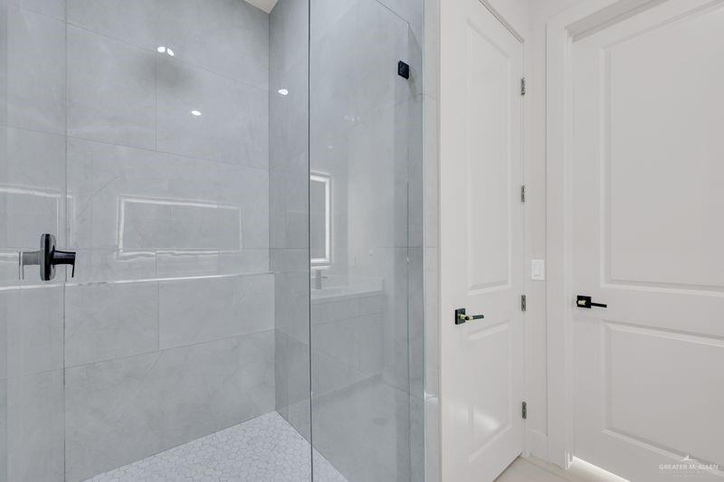 2309 Trinity Avenue McAllen, TX 78504 - Photo 12 of 31 a bathroom with a shower