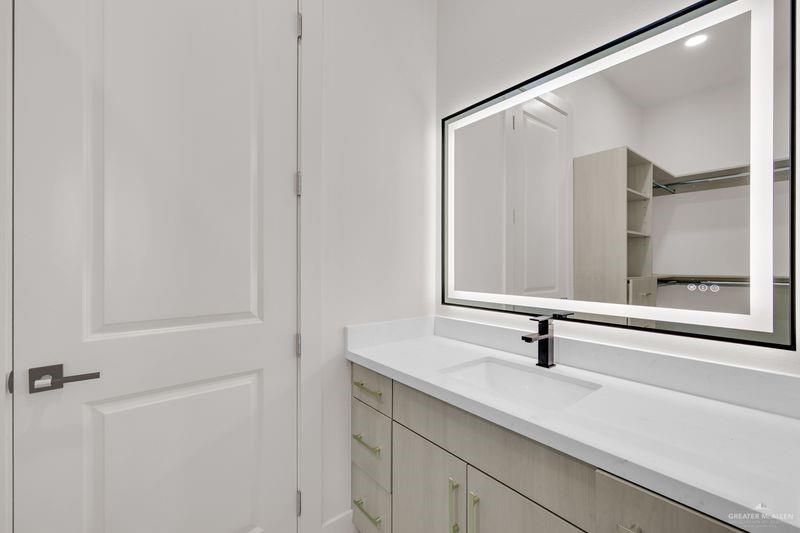 2309 Trinity Avenue McAllen, TX 78504 - Photo 16 of 31 a bathroom with a sink and mirror