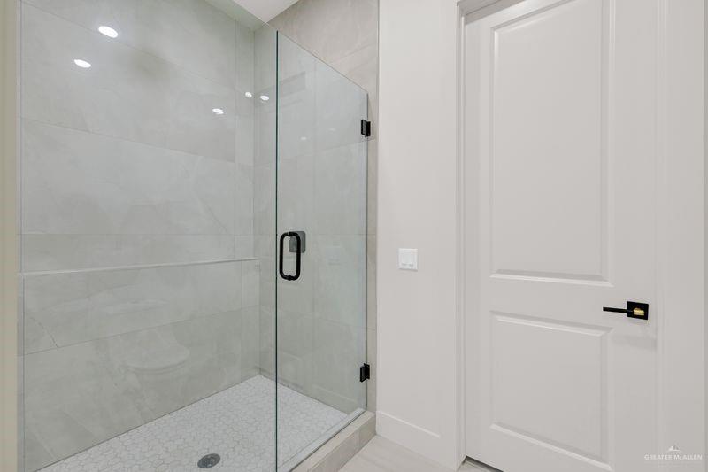 2309 Trinity Avenue McAllen, TX 78504 - Photo 17 of 31 a bathroom with a shower