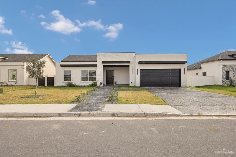 2309 Trinity Avenue McAllen, TX 78504 - Photo 2 of 31 a view of yellow house with a outdoor space