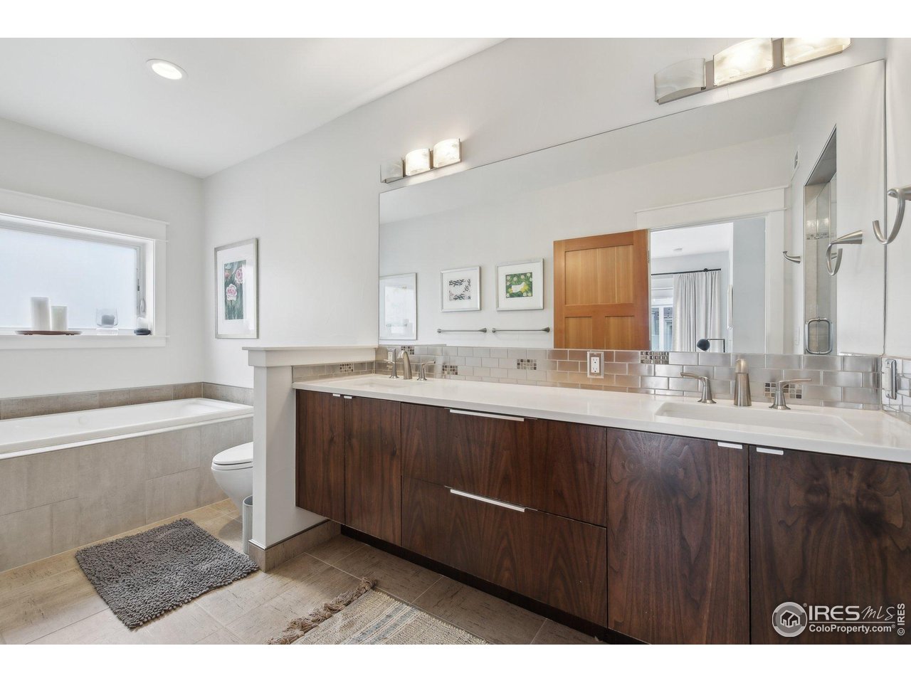 2917 13th Street Boulder, CO 80304 - Photo 13 of 40 a bathroom with a sink vanity granite tub and a mirror