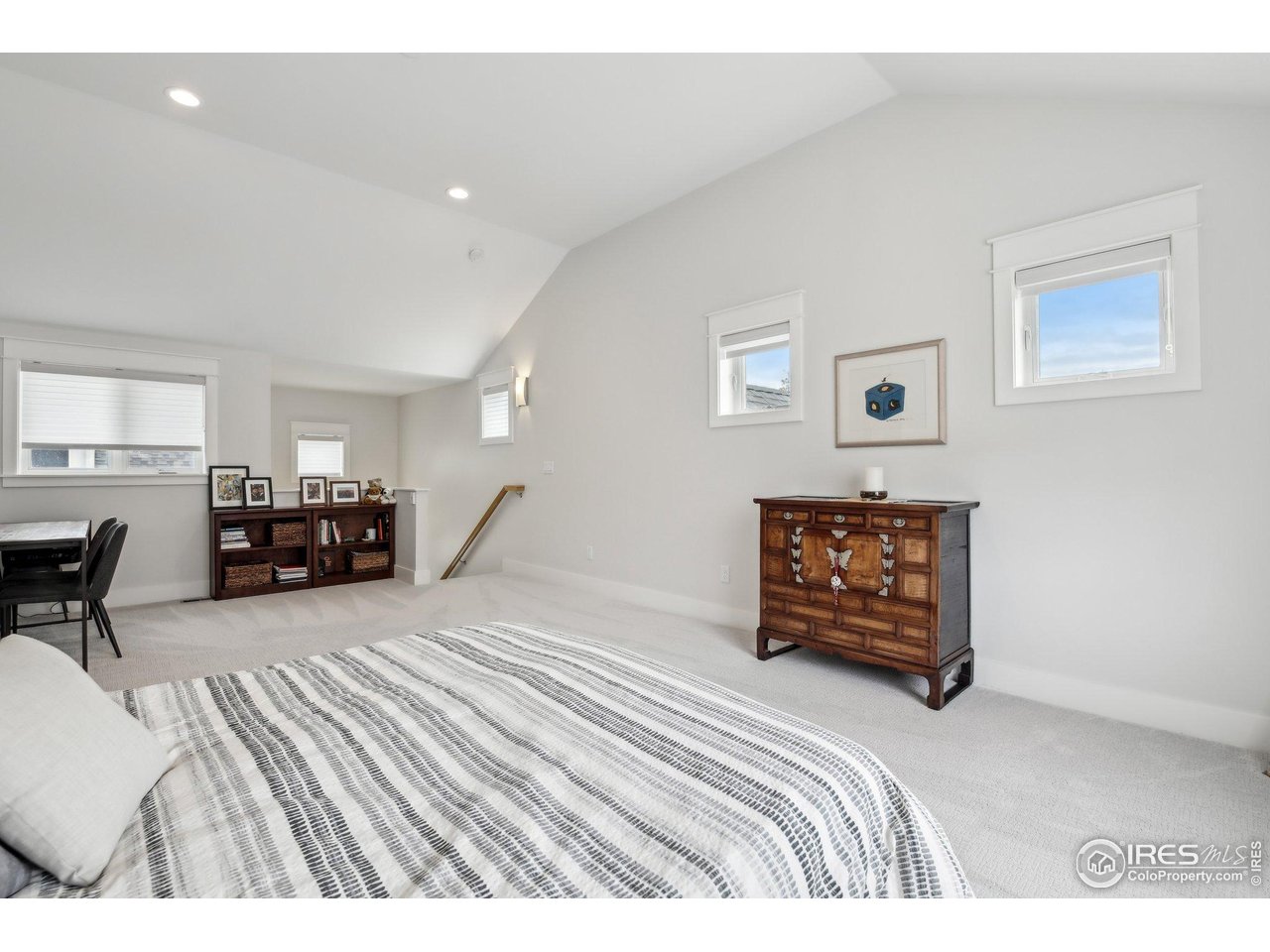 2917 13th Street Boulder, CO 80304 - Photo 16 of 40 a bedroom with furniture and a dresser