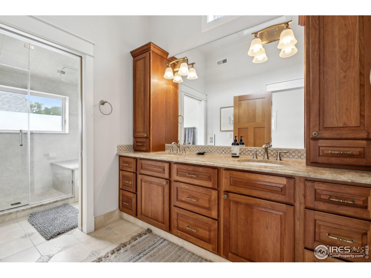 2917 13th Street Boulder, CO 80304 - Photo 18 of 40 a bathroom with a sink and a mirror