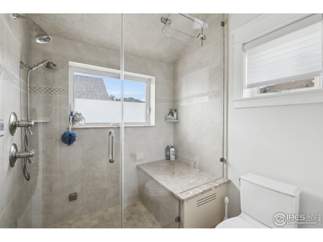 2917 13th Street Boulder, CO 80304 - Photo 19 of 40 a bathroom with a sink toilet and shower
