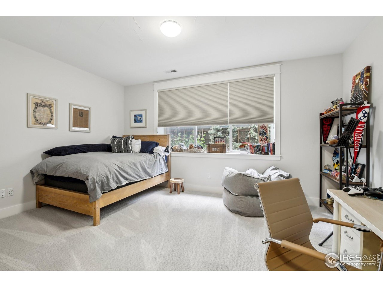 2917 13th Street Boulder, CO 80304 - Photo 24 of 40 a bedroom with a bed couch and a window