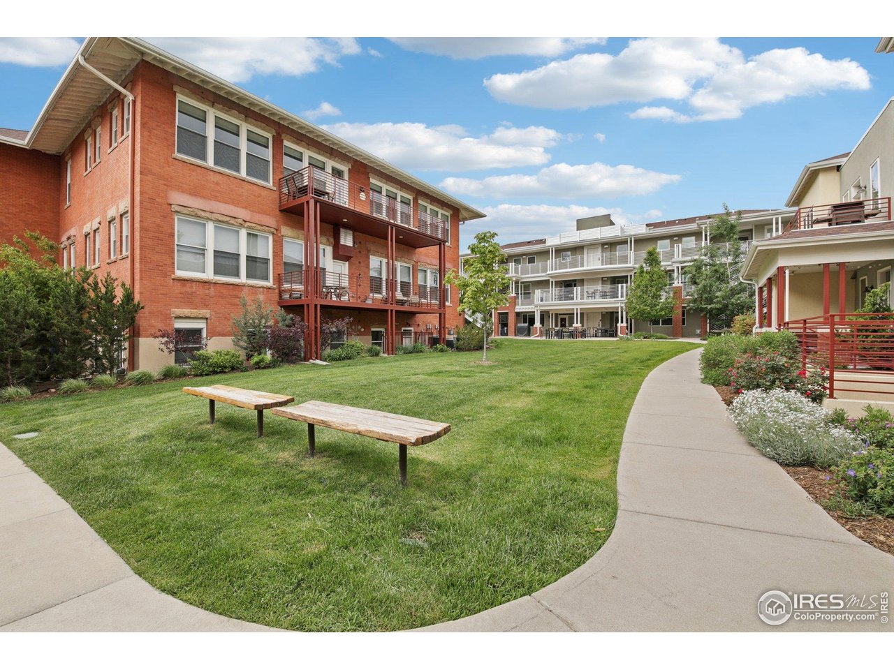 2917 13th Street Boulder, CO 80304 - Photo 38 of 40 a view of a big building with a big yard and potted plants