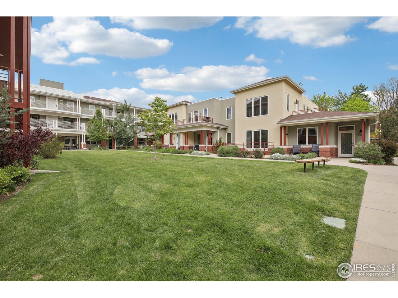 2917 13th Street Boulder, CO 80304 - Photo 39 of 40 a view of a white house with a big yard and potted plants