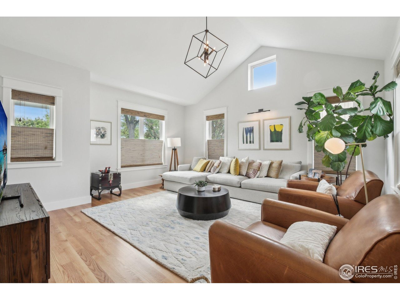 2917 13th Street Boulder, CO 80304 - Photo 4 of 40 a living room with furniture a chandelier