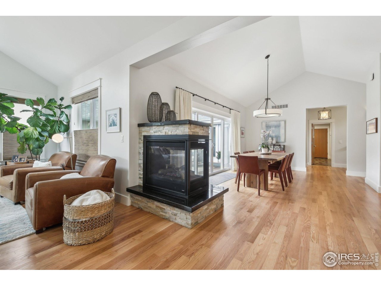 2917 13th Street Boulder, CO 80304 - Photo 7 of 40 a living room with furniture and a fireplace