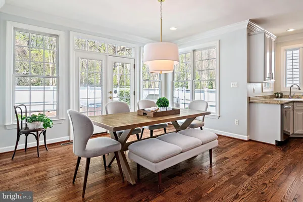 a view of a dining room with furniture window and wooden floor