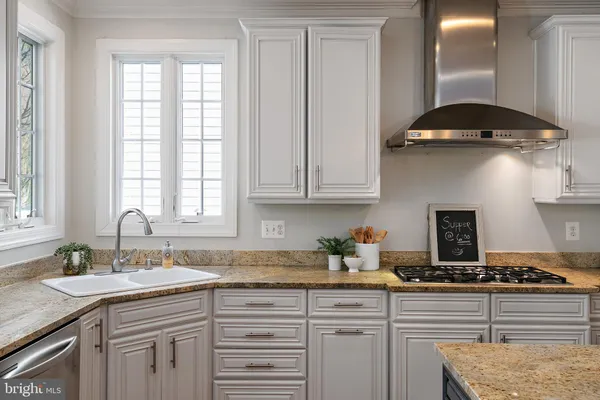 a view of an entryway with wooden floor and windows