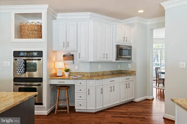 a view of entryway with wooden floor and stairs