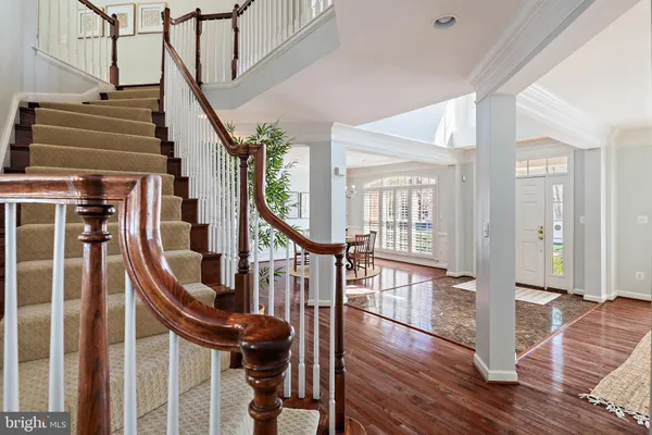 a view of an entryway with wooden floor