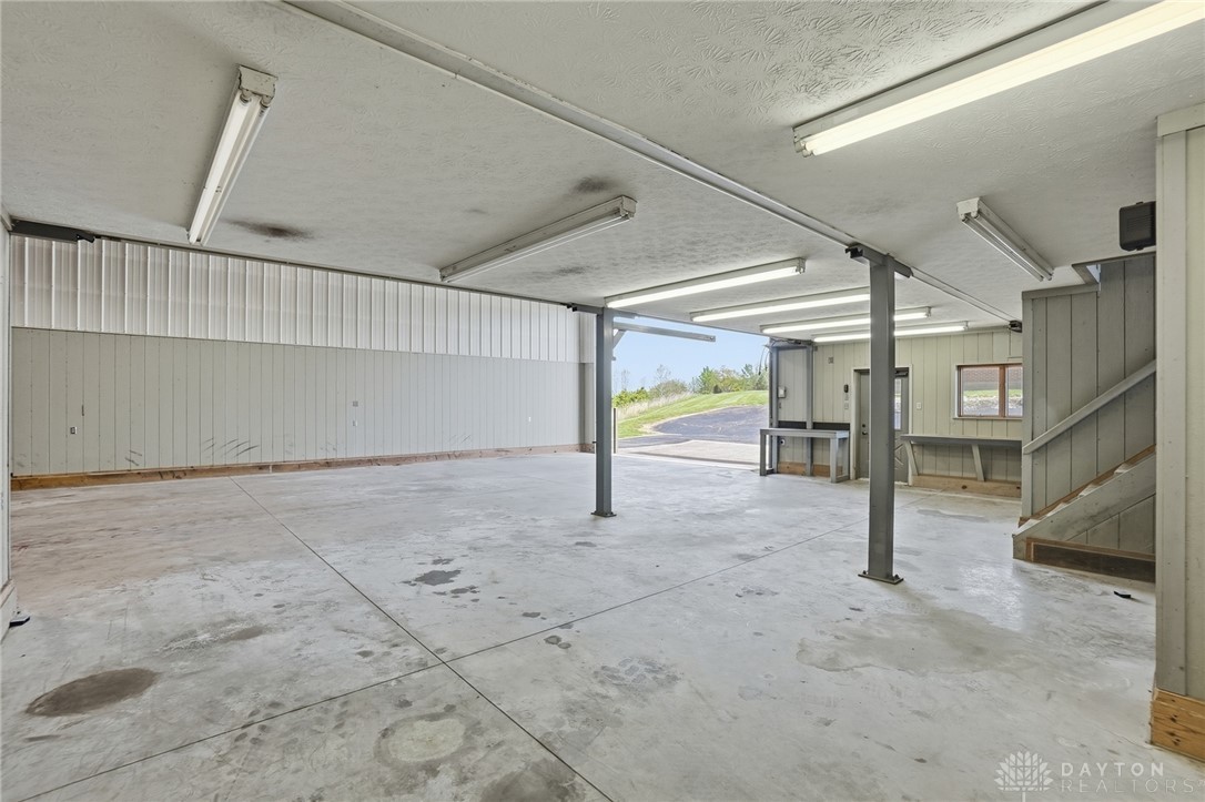 5669 O Neall Road Waynesville, OH 45068 - Photo 58 of 72 This spacious utility area features durable concrete flooring, perfect for various needs and activities.