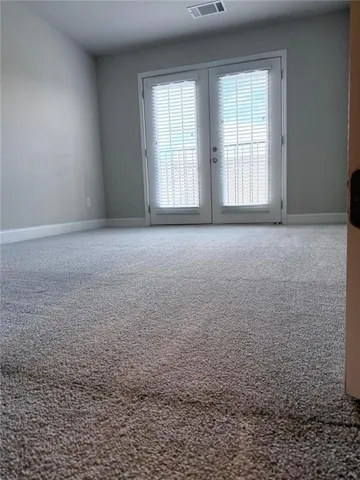an empty room with a empty space and window